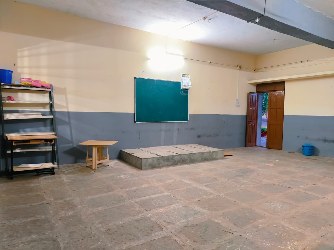 Classroom with blackboard and teaching platform